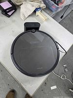 Top view of Xiaowa robotic vacuum seated on charging dock