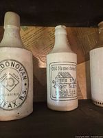 Close-up of W.H. Donovan and Old Homestead printed bottles
