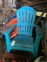 Front view of blue plastic Adirondack chair
