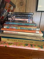 Stack of Twilight DVDs, children’s books, Cinderella jigsaw puzzle