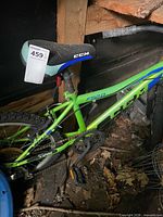 Left side of green CCM FS20 bicycle showing frame, seat and pedal