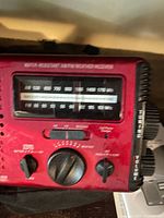 Front view of red Eton FR-400 radio showing tuner, controls and condition