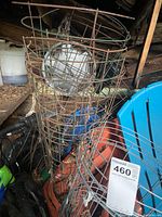Stacked metal wire tomato cages showing overall form and rust