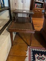 Overall view of two-tier end table showing form and finish
