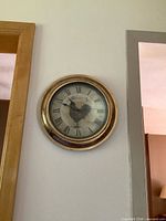 Wall clock visible but not part of lot