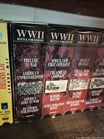 Left section of shelf showing Jim Carrey VHS and first group of Madacy WWII Battle for Europe volumes