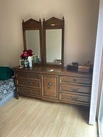 Full view of dresser with two mirrors attached
