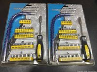 Two identical sealed 44-piece screwdriver sets in blister packs