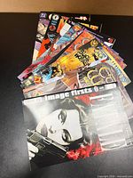 Fan display of entire stack showing variety of covers and publishers
