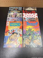 Stack of 10 comics fanned out showing covers including Harbinger, Dreadlands, Bushido issues, Supreme, Legendary, Farmhand, Obey Me