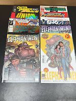 Front view showing Elephantmen #3 and #44 plus stacked additional issues