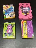 Group shot of all four sealed games in packaging