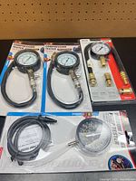 Four sealed tester packages on bench