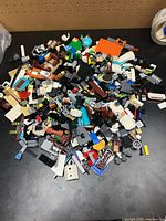 Overview of mixed LEGO pieces pile on table