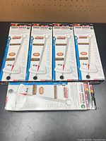 Five boxed Performance Tool torque wrenches arranged on tabletop