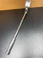Full view of 18-inch breaker bar with tag attached