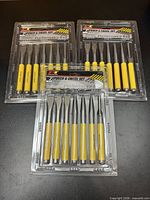 Three identical sealed punch & chisel sets