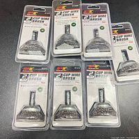 Front view of all seven sealed Performance Tool 2" cup wire brushes