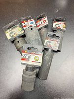Group of six Performance Tool deep impact sockets with packaging tags visible