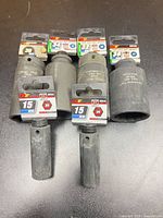 Six Performance Tool impact sockets arranged front and back showing size labels