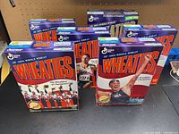 Six Wheaties Olympic edition cereal boxes, front view