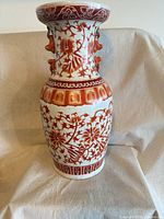 Full front view of porcelain vase showing floral decoration and form