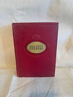 Front view of red hardcover bound volume with Coronet title medallion