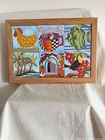 Front view of framed six-tile ceramic plaque