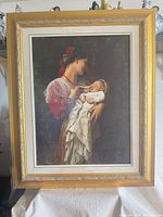 Full view of framed print on stand