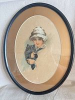 Full view of framed print showing frame, mat, and portrait