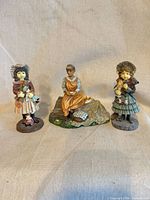 All three figurines front view