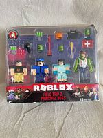 Front view of sealed Roblox Field Trip Z: Principal Boss figure set showing figures and accessories