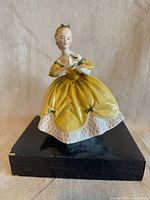 Front view of Royal Doulton The Last Waltz figurine on display stand