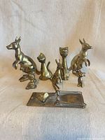 Group shot of all eight brass pieces