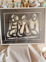 Full view of framed lithograph showing three figures and frame