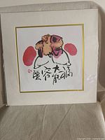 Full view of matted square art print in plastic wrap