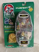 Front of sealed Tarzan Micro Action Playset showing figures and badge