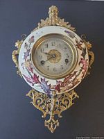 Full front view of porcelain clock with brass mounts