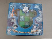 closed tin box showing branding and Mickey window