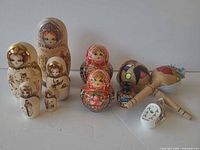 Group view of all wooden items: both doll sets, maracas, vase, clog