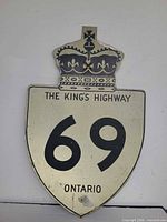 Full view of Ontario Highway 69 shield sign showing crown and numerals