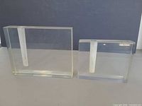 Both acrylic block vases front view showing size difference