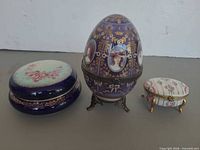 Group view of three porcelain trinket boxes