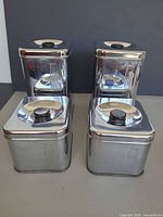 Front view of all four canisters lined up