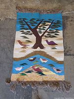 Full view of tapestry showing entire design and fringe