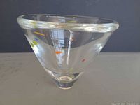 Side view of clear conical bowl showing multicolor confetti inclusions