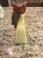 Front three-quarter view showing owl detail and alabaster block
