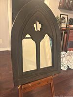 Front view of Gothic arched mirror on easel