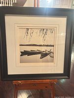 Front view of framed print showing black frame and double mat