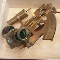 overall view of brass sextant showing telescope, mirrors, filters